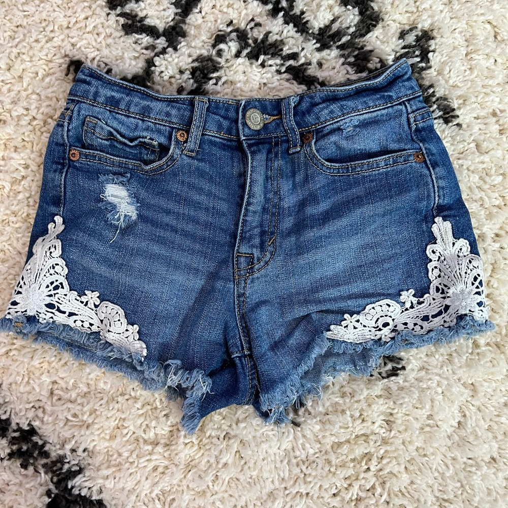 Aeropostale denim shorts with lace detail.